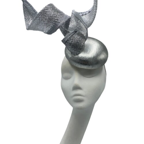 Silver coloured headpiece with shiny silver centre base with a beautiful sparkly swirl intertwined all around the hat and twisted in the centre.